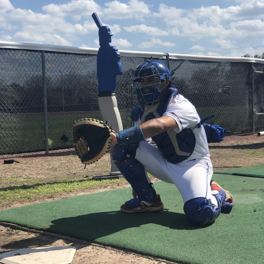 Catcher Miguel Useche, #13, waits to receive a pitch