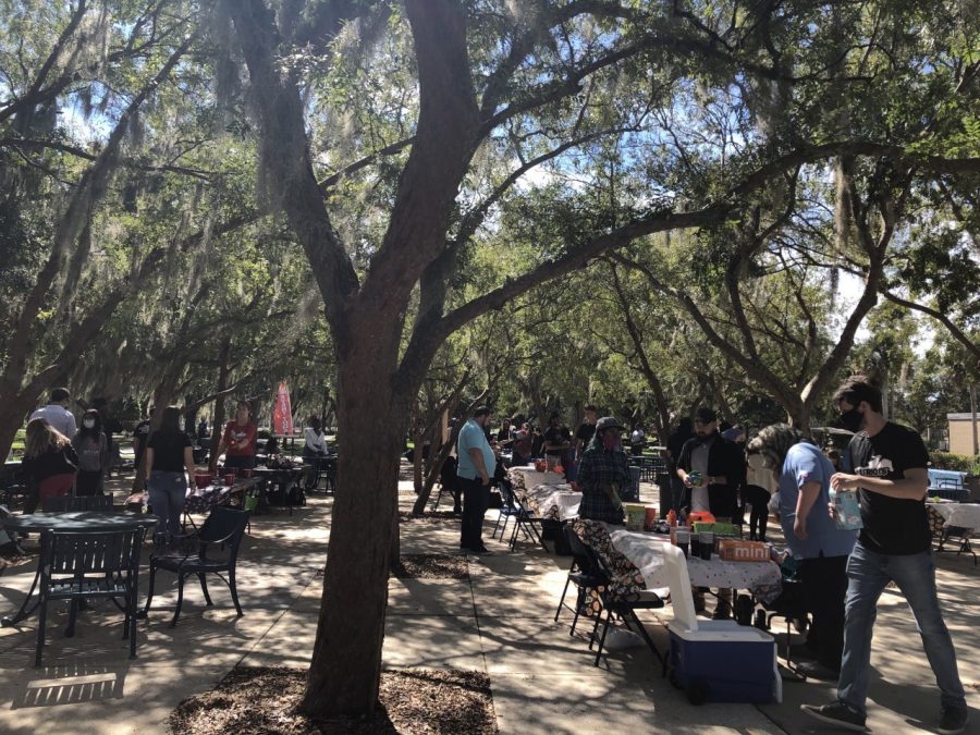 Tables under the shade set up for the Fall Festival, Wednesday, Oct. 27, 2021.