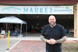 Event curator, Matt Gray, standing proudly outside the Ocala Oddities Market.
