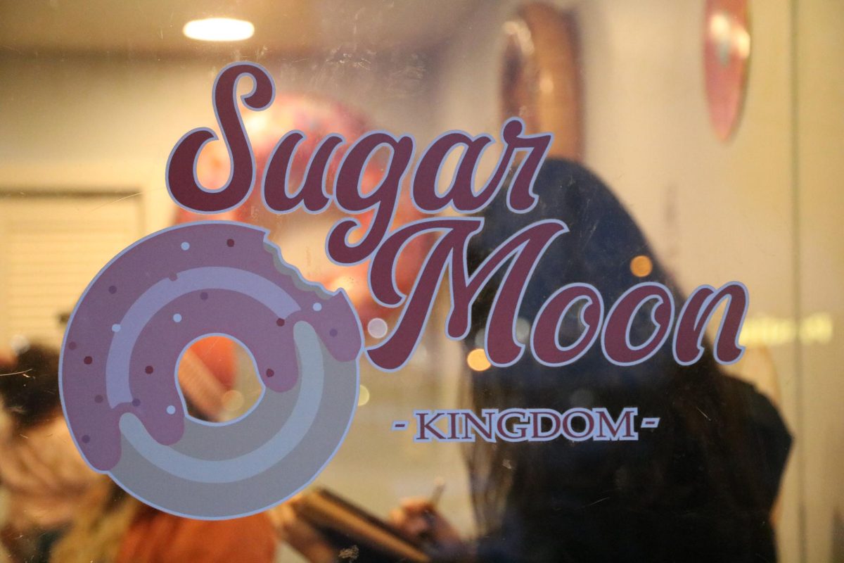 The logo on the door of Sugar Moon Kingdom.